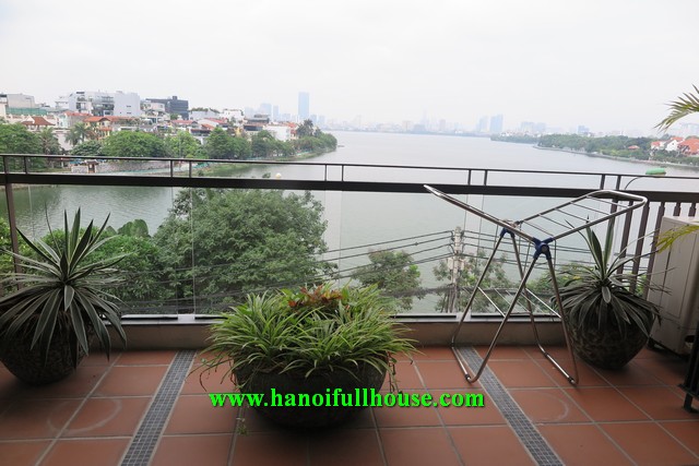 Big balcony apartment on Xuan Dieu street, 2 bedrooms, a lot of light for rent.