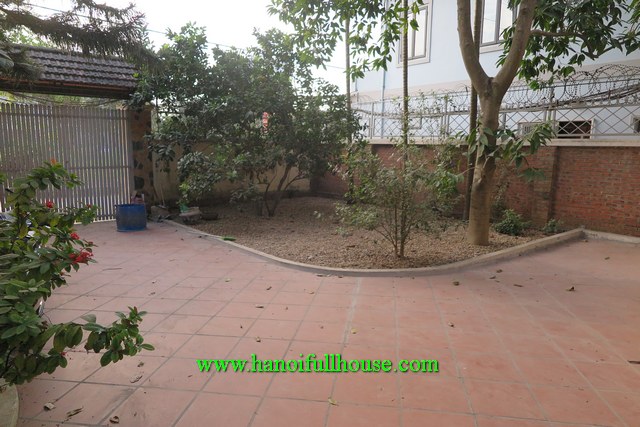 2-storey partially furnished house with a big courtyard and garden in Tay Ho dist for lease